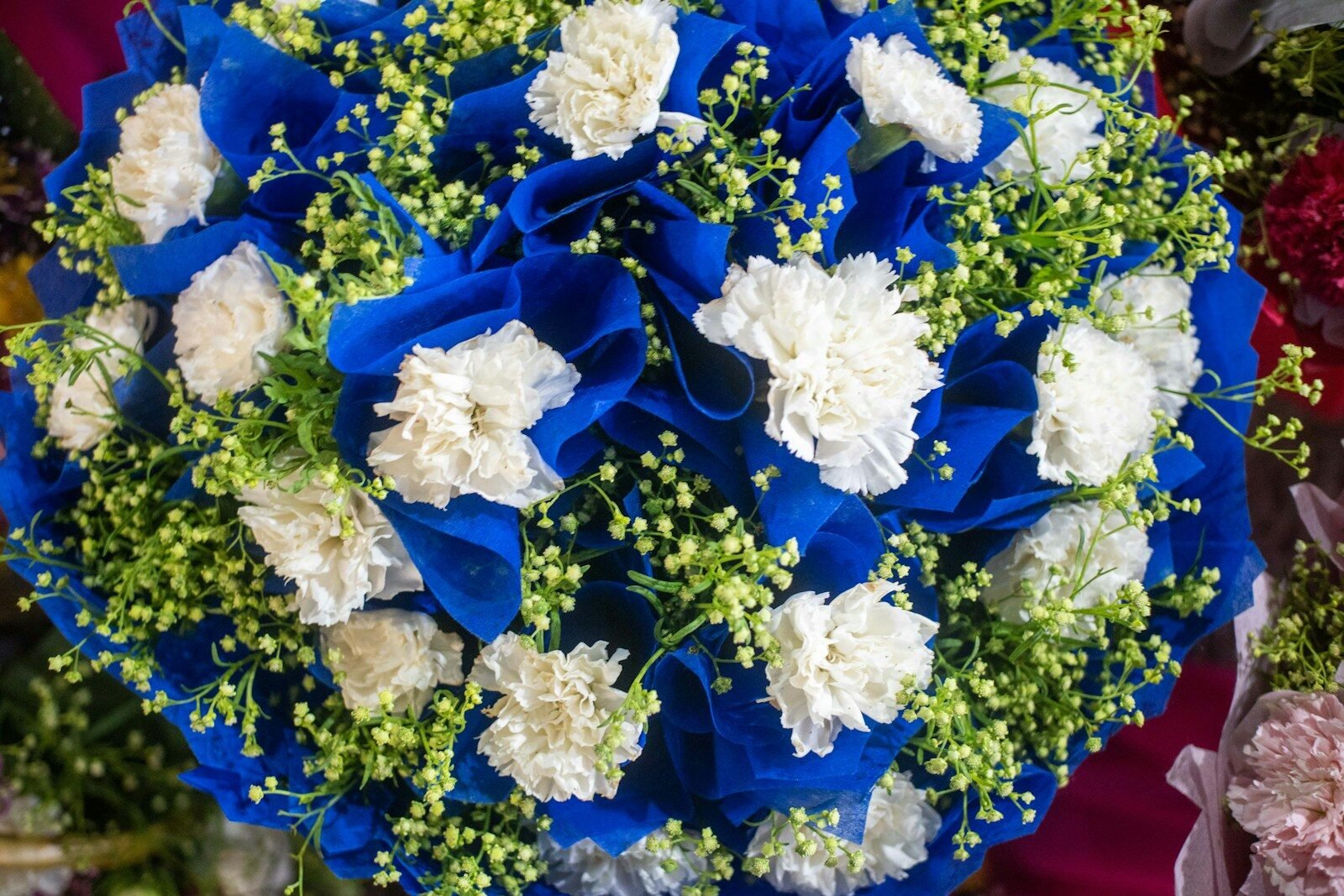 Bouquet of blue and white flowers is colorful.