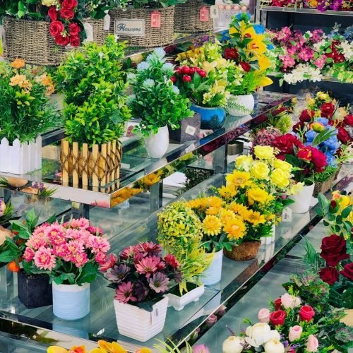 a flower shop filled with lots of colorful flowers